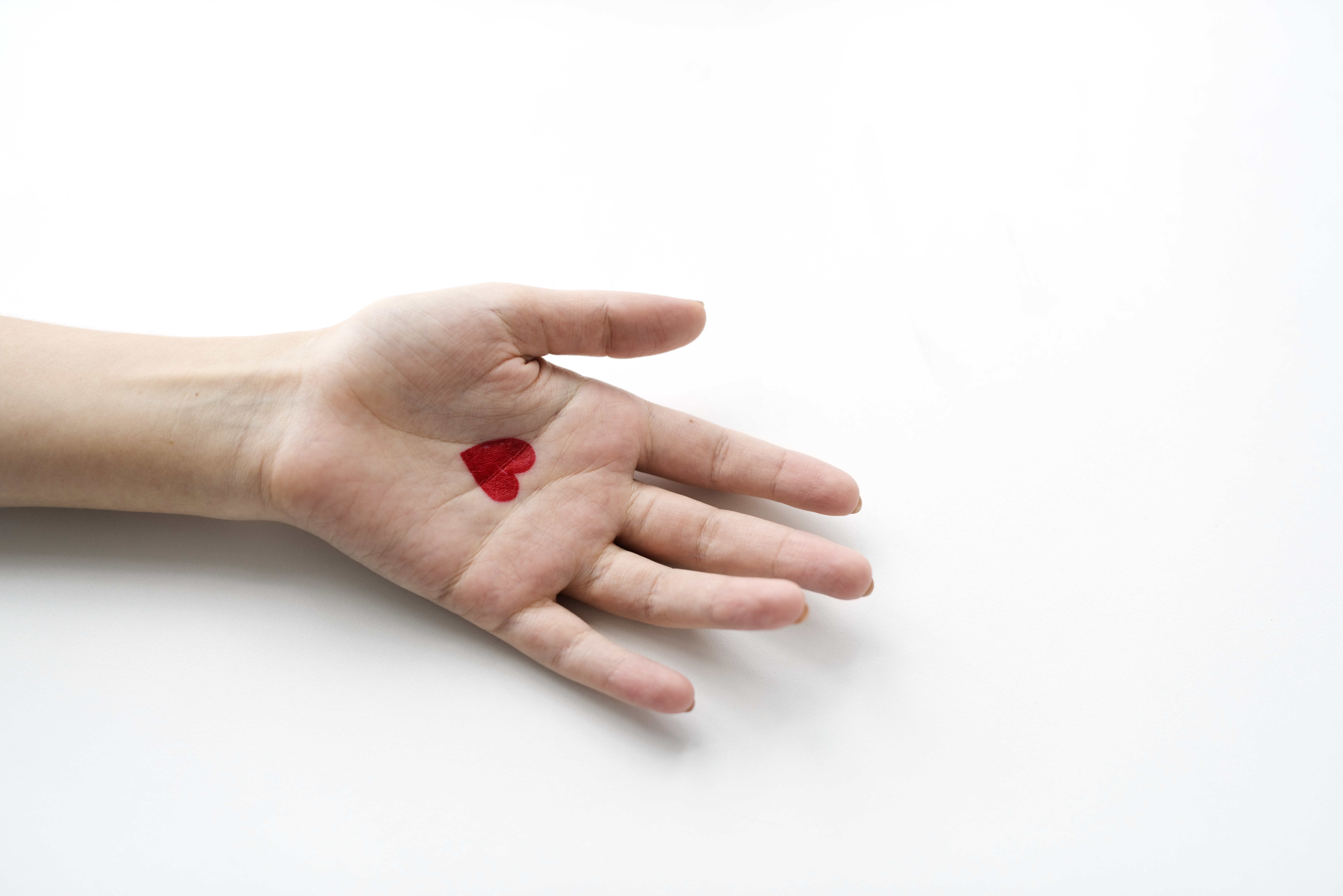 aerial-view-heart-drawing-hand-white-background.jpg