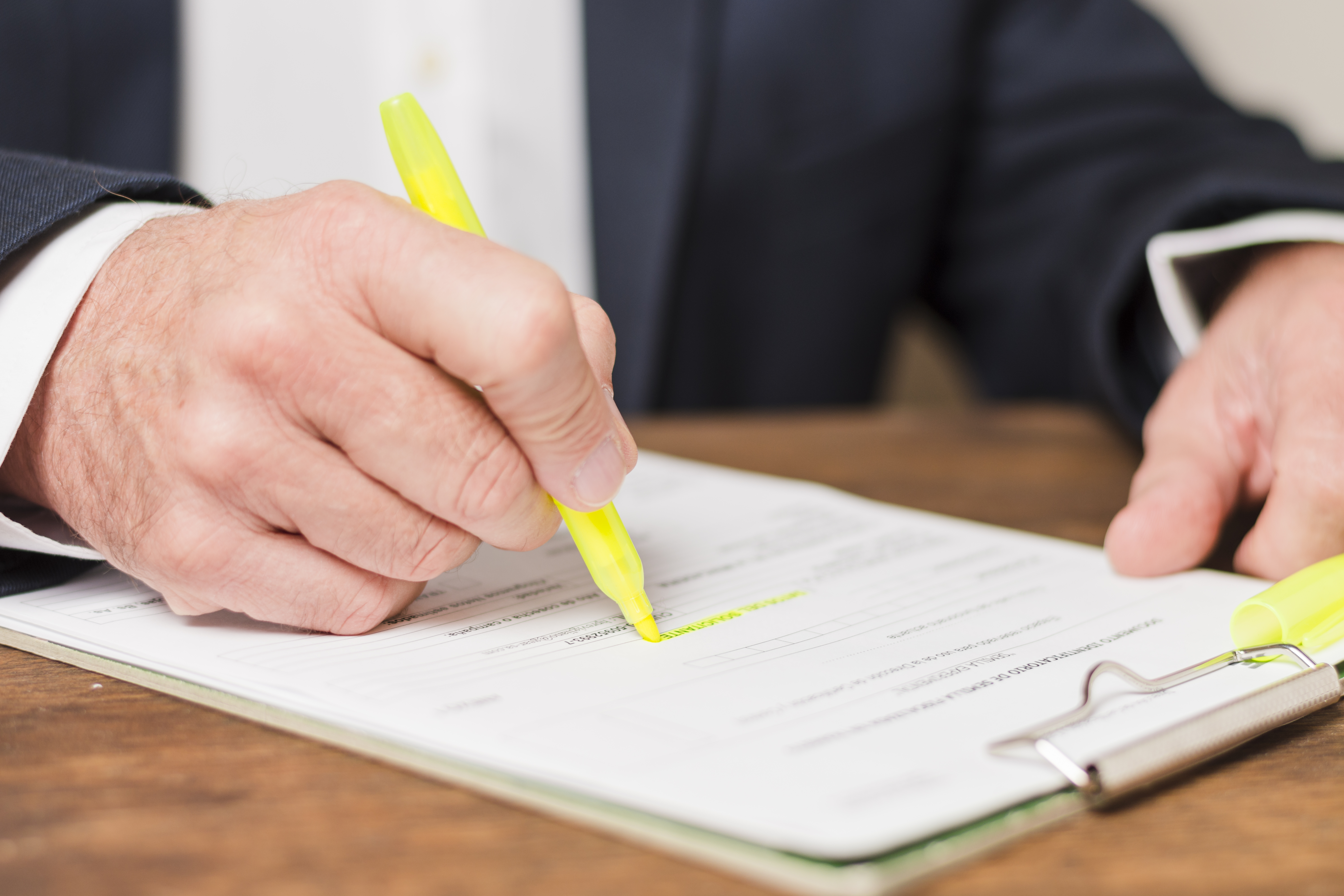 businessman-writing-documents.jpg