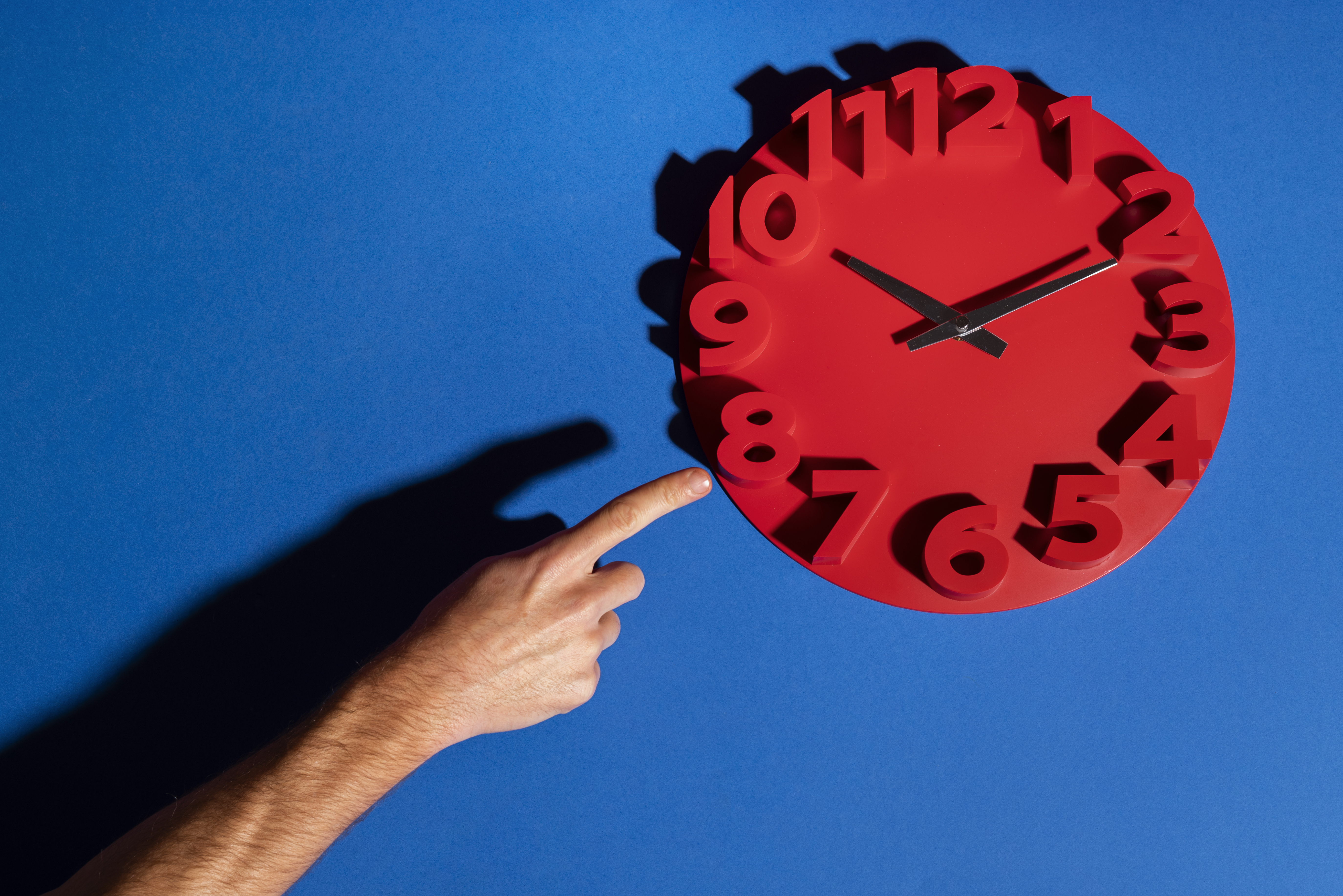 hand-holding-wall-clock-still-life.jpg