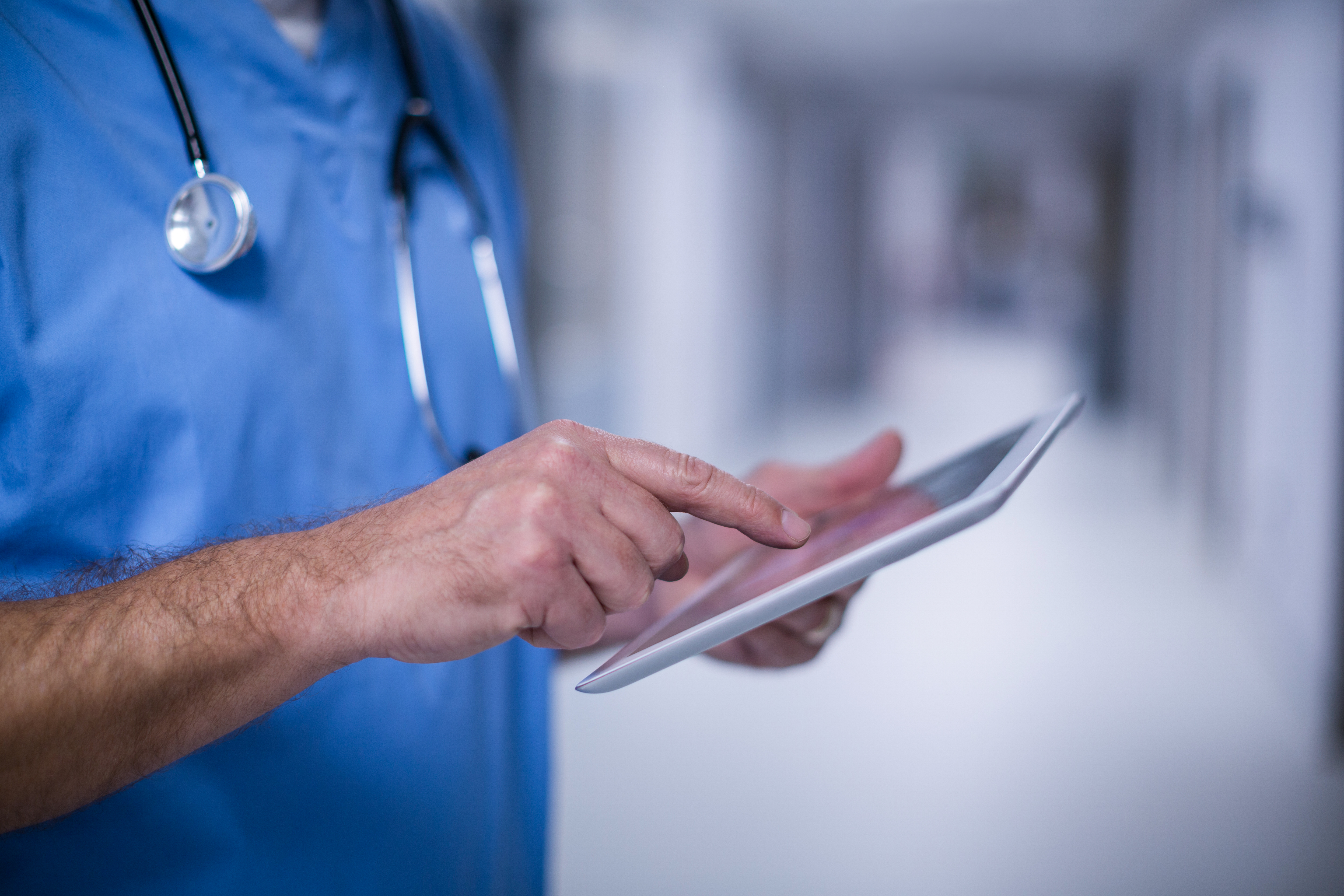 male-surgeon-using-digital-tablet-operation-room.jpg